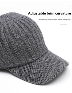 Close-up of gray knitted baseball cap featuring wide foldable brim and ribbed texture