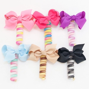 Set of 6 colorful bow spiral telephone wire hair ties in pink purple and blue
