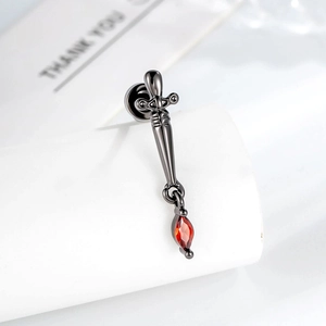 Gothic gunmetal dagger stud earring with a marquise-cut red zircon drop pendant