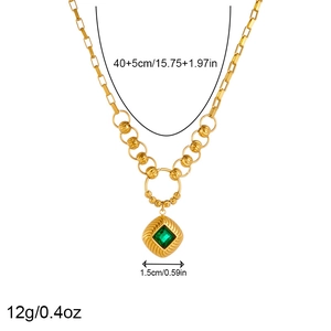 Detail of gold chain necklace with green square pendant and 40+5cm length dimensions