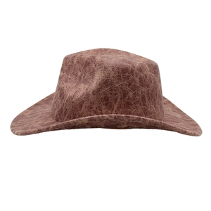 Detailed view of the distressed faux leather texture on a brown western cowboy hat