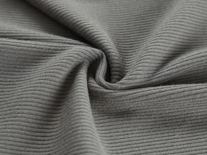 Detailed close-up of grey ribbed knit fabric texture with high elasticity and soft finish