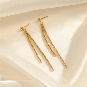 Elegant gold-plated long tassel earrings in stainless steel on white silk background