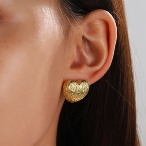 French vintage heart stud earrings in brushed gold with unique textured metal finish