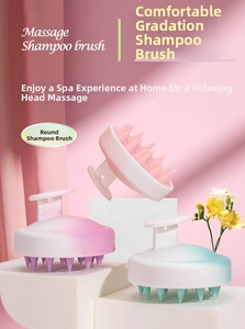 Detail showing silicone scalp massager brush with T-shaped handle in gradient colors