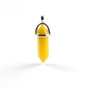 Macro view of a hexagonal yellow citrine pendant with a polished silver metal clasp