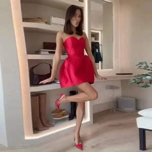 Elegant red satin strapless mini dress with a flared skirt for formal parties