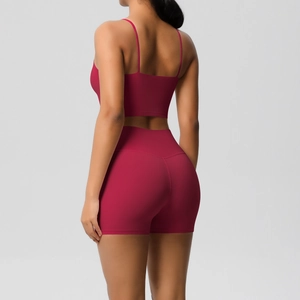Detail of high-waisted berry red yoga shorts and thin strap back design sports bra set