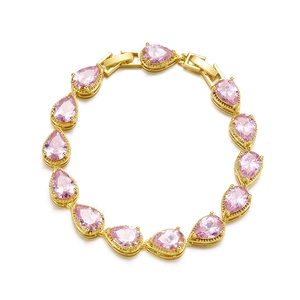 Detail of gold bracelet featuring thirteen pear-cut pink zircons in a teardrop setting