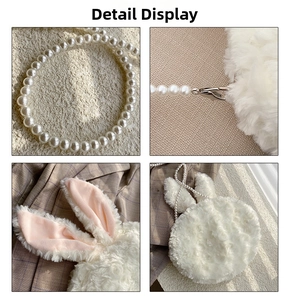 Detail of white plush rabbit bag showing pearl chain strap and soft faux fur texture