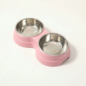 Detail of pink double pet feeder with two removable stainless steel bowls for cats and dogs