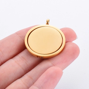 Minimalist golden stainless steel rotating disc pendant with smooth polished surface