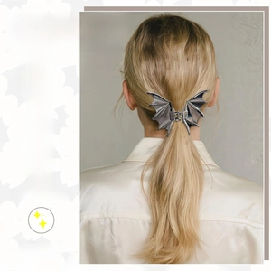 Gothic silver metal bat wing hair claw clip shown on blonde hair for a stylish look