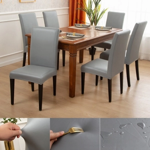 Detail of grey PU leather chair covers showing waterproof and high elasticity features