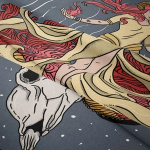 Detailed view of tapestry fabric with goddess and ox skull print on fine textile