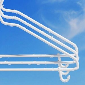 Heavy-duty white non-slip clothes hangers for wet and dry use under a blue sky