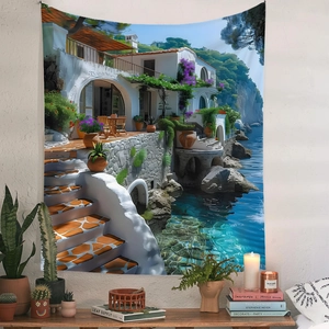Detail of bohemian tapestry with Mediterranean coastal scenery hung on a textured white wall