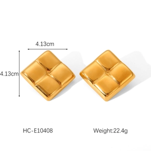 Detailed view of gold square earrings with embossed grid pattern and size measurement