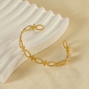 Elegant gold-plated open bangle featuring a hollow cross design and textured metal finish