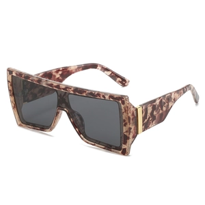 Modern oversized tortoiseshell butterfly sunglasses with dark grey lenses and gold metal accents