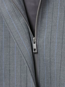 Macro detail of high-quality fabric texture and smooth metal zipper on grey striped jacket