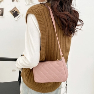 Pink quilted shoulder bag with classic rhombus pattern and golden zipper detail