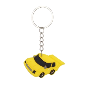 Detailed view of yellow PVC cartoon car keychain with metallic ring and chain link