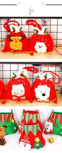 Detail of Christmas drawstring gift bags with plush Santa, Snowman and Reindeer designs