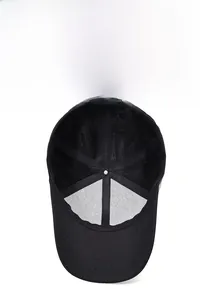 Detail of black baseball cap showing breathable mesh lining and adjustable metal buckle