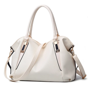 Minimalist beige lychee leather tote bag with gold hardware and removable shoulder strap