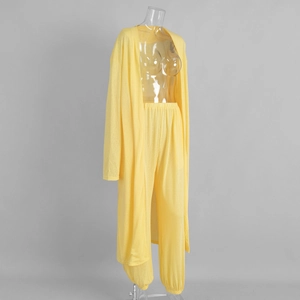 Detail of yellow long-sleeved cardigan and high-waisted pants in breathable knit fabric