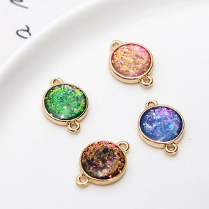 Gold-plated circular geometric opal resin charms with dual loops in four vibrant colors