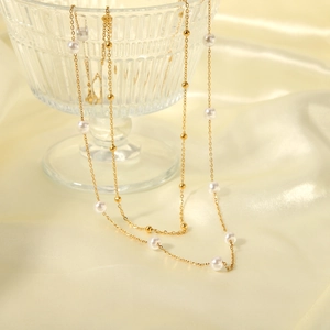 Layered 18K gold plated stainless steel necklace with white pearls and metal beads