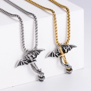Detail of gothic dragon sword pendants in silver and two-tone steel on white geometric stands