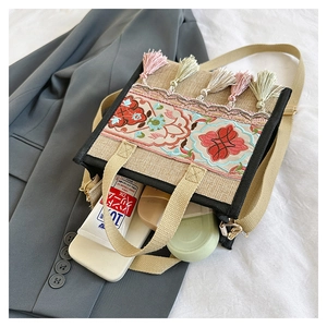 Detail view of ethnic embroidery tote showing large capacity with personal items