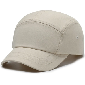 Minimalist beige 5-panel canvas camp hat with short brim shown at 45-degree angle