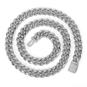 Detailed view of silver Cuban link chain with a sparkling zircon encrusted box clasp