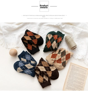 Flat lay of five pairs of vintage argyle knit cotton crew socks in assorted retro colors