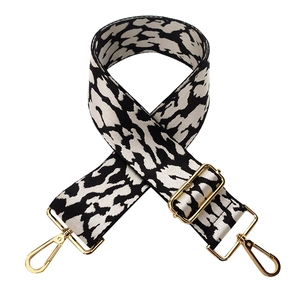 Detail of 5cm wide leopard print jacquard strap with adjustable golden metal buckles