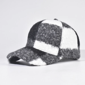 Close-up of black and white checkered baseball cap showing warm fuzzy wool texture