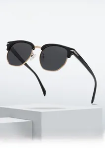 Detail view of semi-rimless retro polarized sunglasses with a black frame and gold bridge