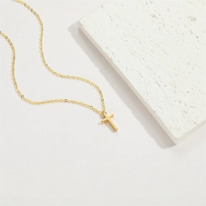 Minimalist 14K gold plated cross pendant necklace on a polished fine link chain