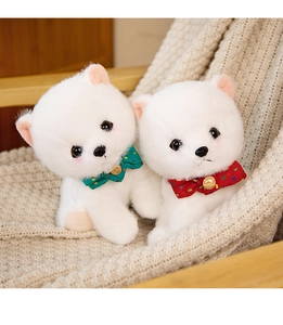 Detailed close-up of fluffy white Pomeranian plush toys with polka dot bow ties on a soft rug