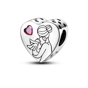 Macro detail of silver heart charm with pink gemstone and mother-child embrace motif