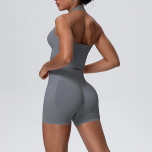 Detail of gray seamless knit yoga set showing halter top and high waist lifting shorts