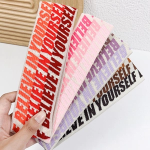 Set of colorful elastic sports headbands featuring Believe in Yourself print for fitness