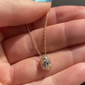 Elegant pear cut zircon pendant necklace in bezel setting on a fine gold chain for women
