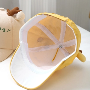 Detail of baby baseball cap showing internal sweatband, neat stitching and 3D giraffe antlers