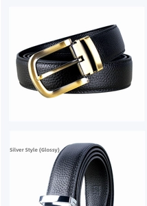 Detail of premium black lychee grain leather belt with gold and silver alloy buckles