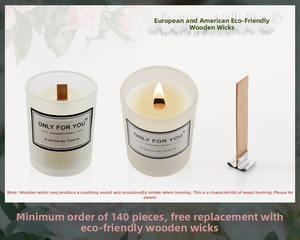 Close-up of eco-friendly wood wicks and frosted glass scented soy wax candles